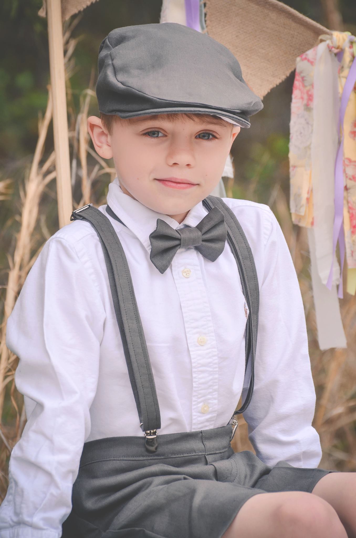 Lori , This beautiful four piece set; newsboy hat, bow tie, suspenders and shorts are made from timeless ch...