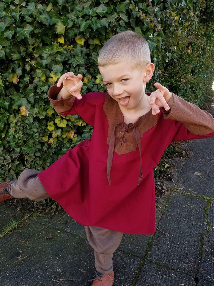 James, A red and brown boys tunic. 