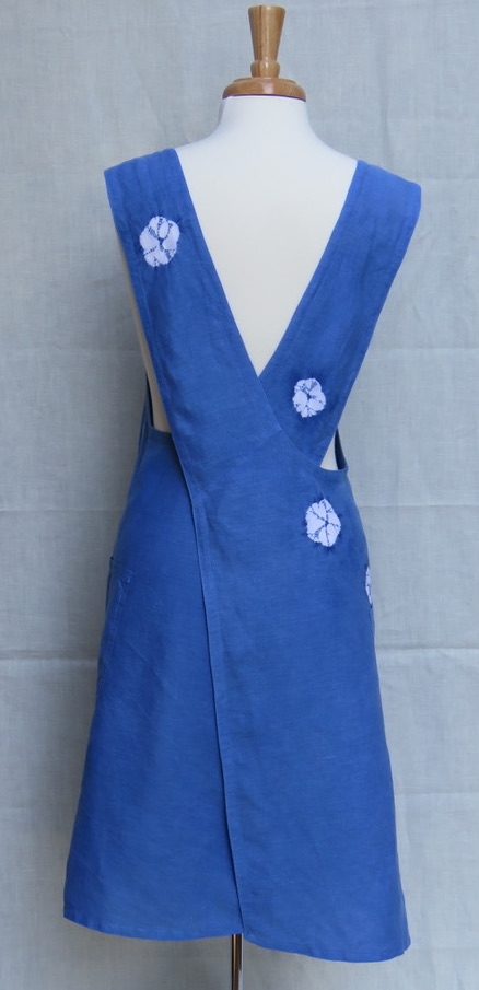 Erica, Back view of Indigo dyed Shibori embellished apron/overdress in midweight linen.