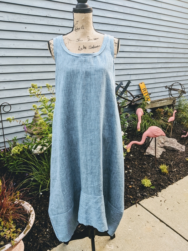 Jane, Asymmetrical hemmed dress with raw edged bias trim on neckline and armholes. 100% Linen
SunRags Stud...