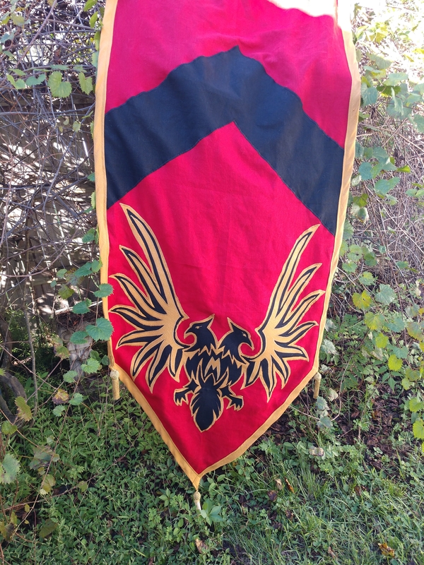 Crissy, Banner for Mythic Adventures, made of ILO19 in Crimson, Black, and Autumn Gold. Layered appliques to...