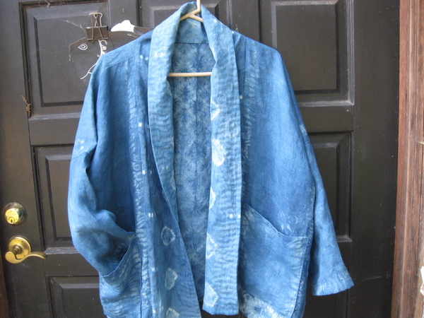 Holly, This is a lightweight 5.3 oz linen.  I scoured it.  Stitched it with Shibori designs and indigo dyed...