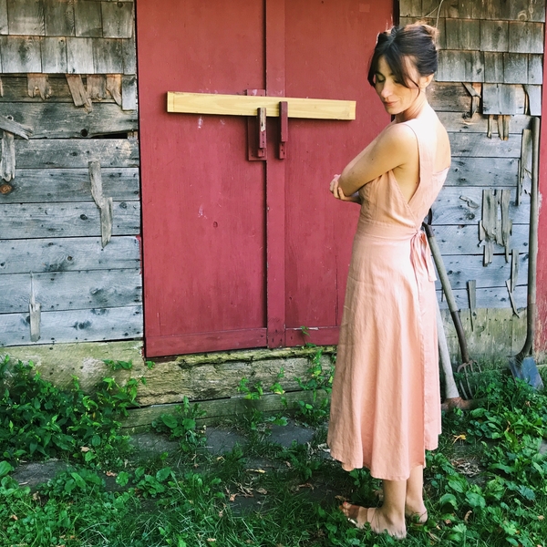 Abby, 70s style apron sundress in 100% blush linen. The back wraps and buttons in front and then front tie...