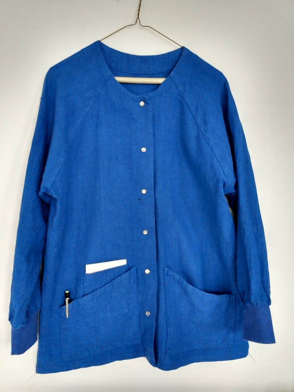 SUSAN, Custom raglan sleeve scrub coat with pocket details for accessories in royal blue.