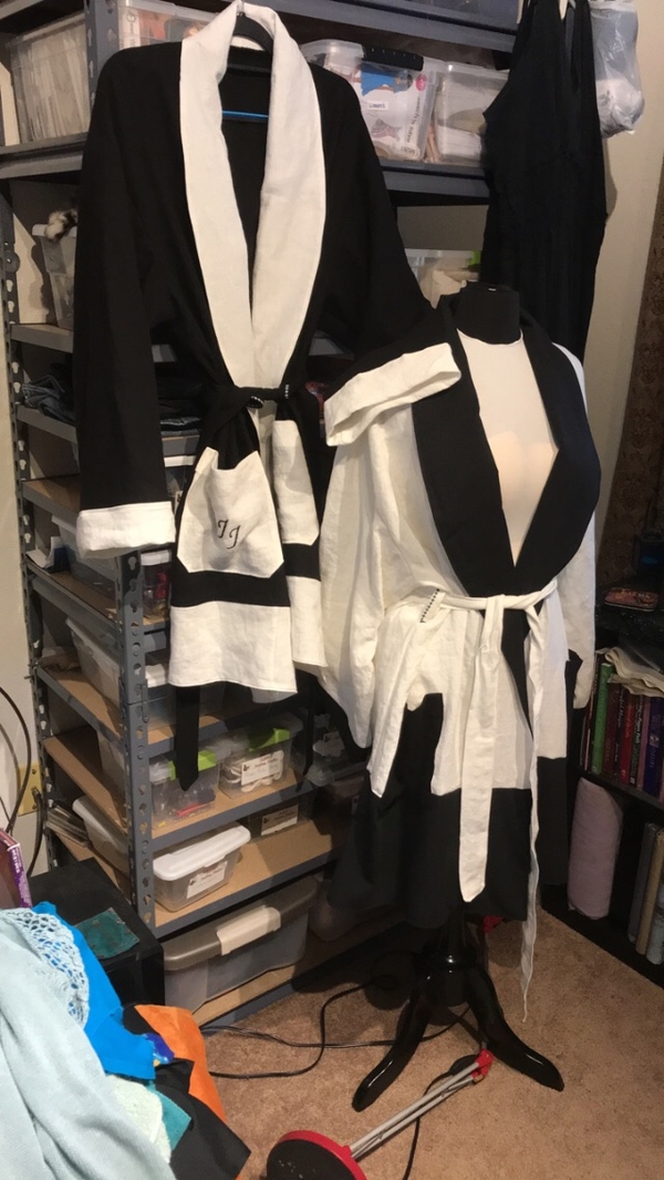 Judith, This is a his and hers set of Housecoats and sleep pants, mix of white and black linen.  J and J emb...