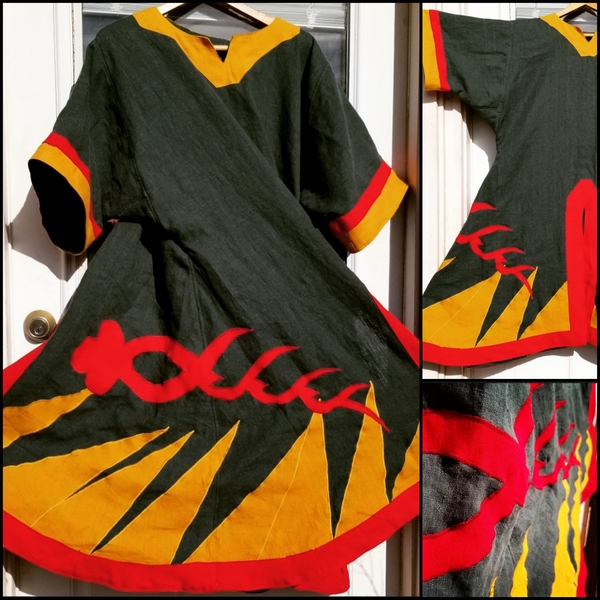 Rainey, An 11th century styled split t-tunic appliqued with our kingdoms war banner. The fabric is linnen a...