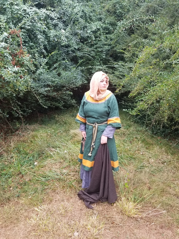 Chelsey, A reproduction of an 11th century Anglo-Saxon woman. Made of emerald green linen with gold trim, wor...