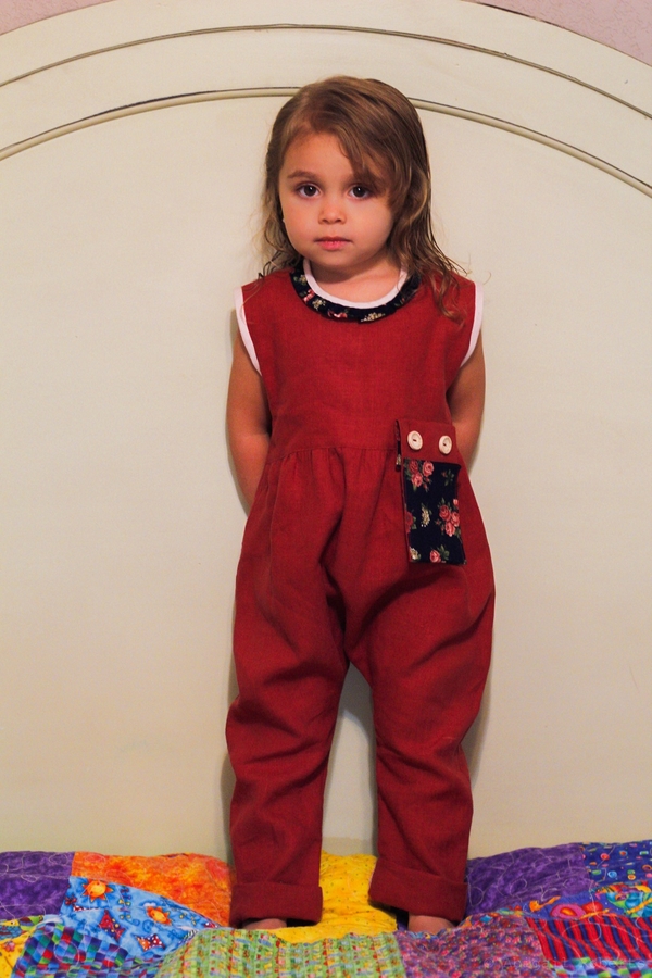 judy, Romper in Deep Claret with contrasting linen binding, neck ruffle and detachable pocket.  Other pock...