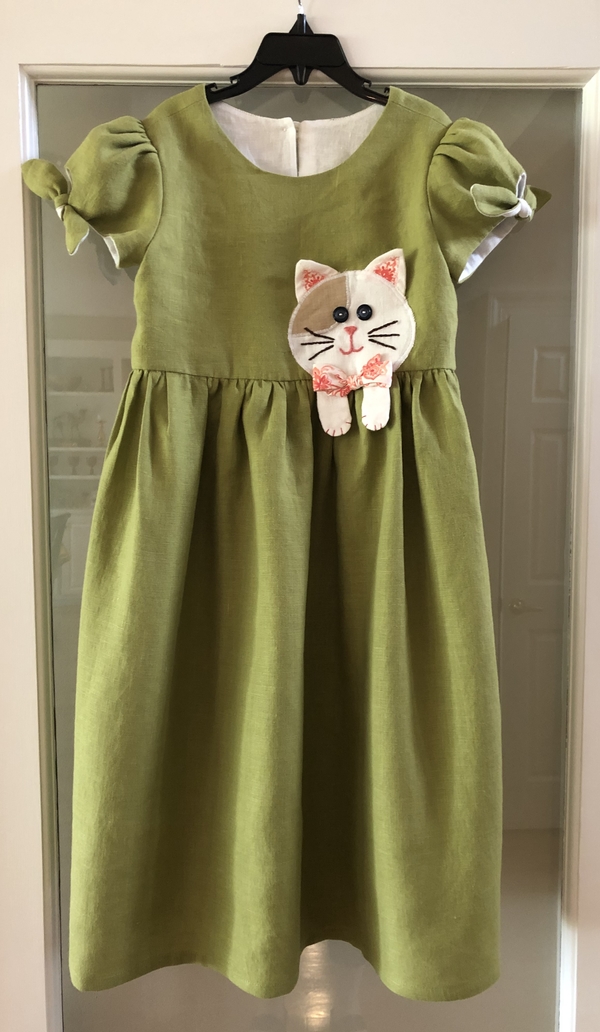 JOY, Cat dress for my grand daughter using a Simplicity pattern.

IL019 Oasis Softened fabric was so easy...