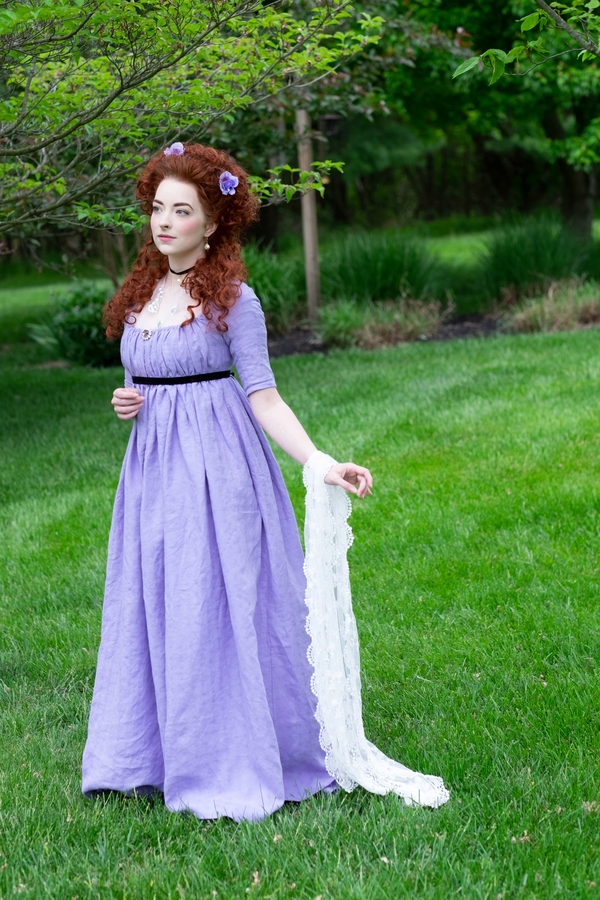 Kelly, This late 1790’s round gown is made from a woven patterned linen. It is secured with drawstrings, an...