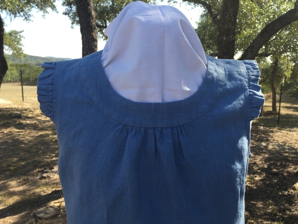 Melissa, A detail shot of my linen blouse, showing the gathered neckline and ruffled sleeve caps.