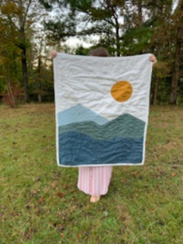 Mercy, Hand quilted baby quilt with a Mountain View.