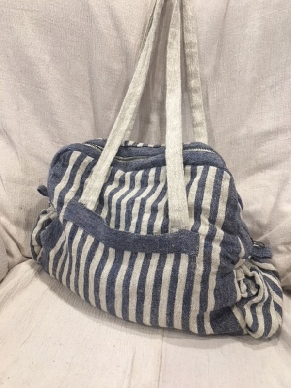 Kathy, THE BAG: The blue stripe exterior has pockets to hold your bottle or cup and phone, calendar & k...