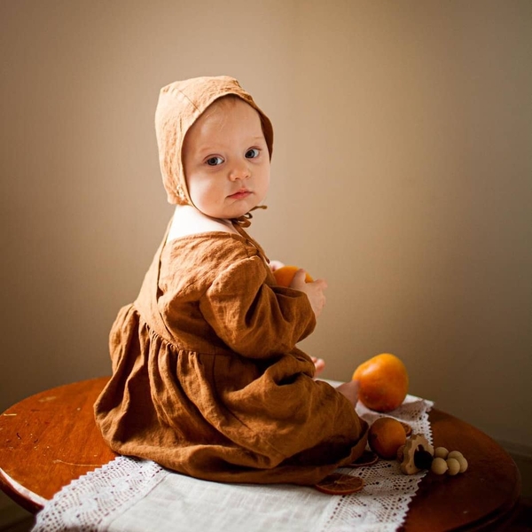 Emma, This linen dress and embroidered bonnet (designed and sewn by me) were part of a collaboration with...