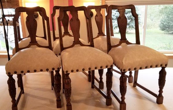 Jill, Antique dining chairs. Inner springs were retied and chairs were covered in a leather-like vinyl and...