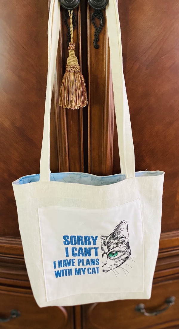 Patricia, With the left over linen from the wall banner, I made a tote for a dear friend who loves cats.