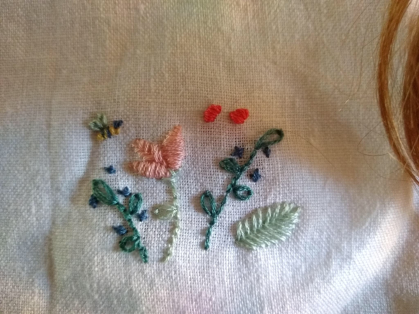 Eileen, Hand embroidered for my toddlers overalls on bleached linen.
