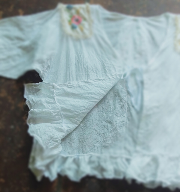 Michelle, A light cover up in white linen with crushed ruffles, vintage doily and tie front.