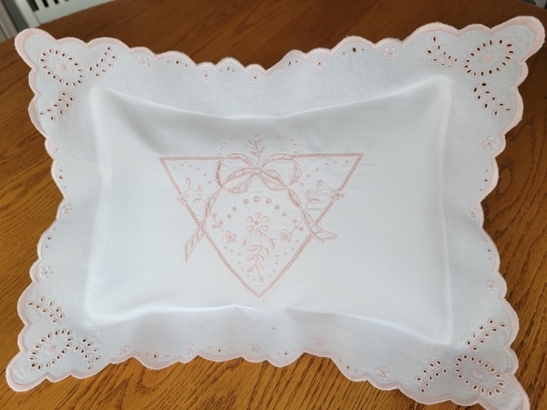 Celeste, 12 x16 linen pillow with white work done in pink floche.  All embroidery (cut-work, granitos, sa...