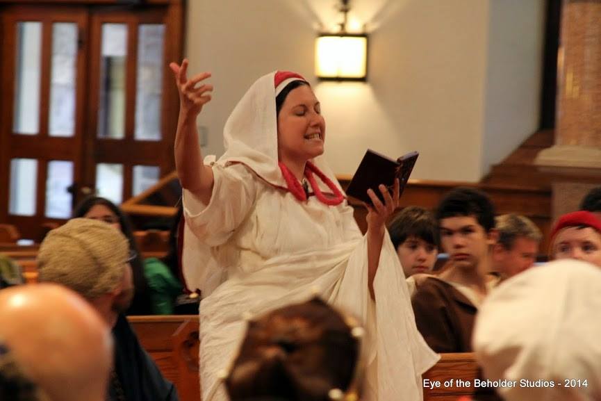 Angela, Vestal Virgin reading prophecy at East Kingdom Coronation.