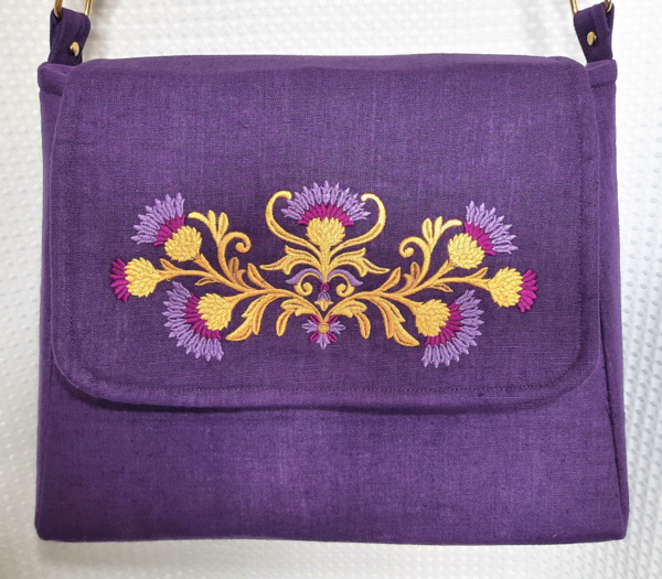 Linda, This cross-body handbag is a new style bag that is a bit larger, created with pure linen, and heavil...