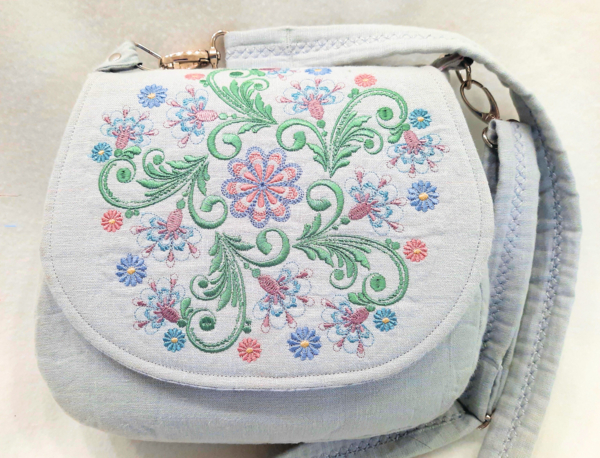 Linda, This cross-body handbag is a new style bag that is a bit smaller, created with pure linen, and heavi...