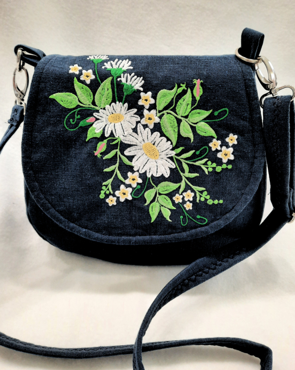 Linda, This cross-body handbag is a new style bag that is a bit smaller, created with pure linen, and heavi...