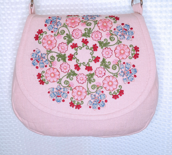Linda, This cross-body handbag is a new style bag, created with pure linen, and heavily embroidered for bea...