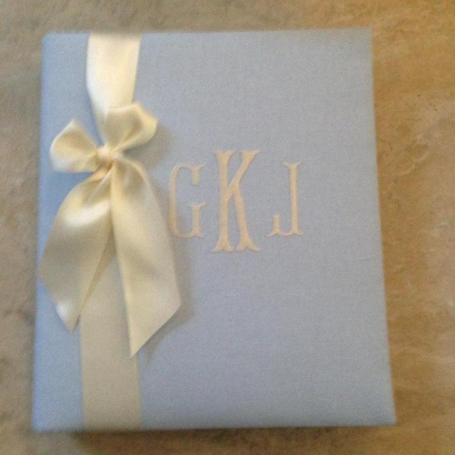 Susie, blue linen baby book with an ivory monogram and satin ribbon.  We love making our baby books out of...