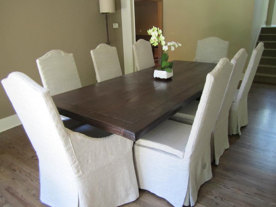 Cassi, 6 dining chairs along with 2 captain chairs (wood arms) were covered in Mixed Natural Softened Linen...