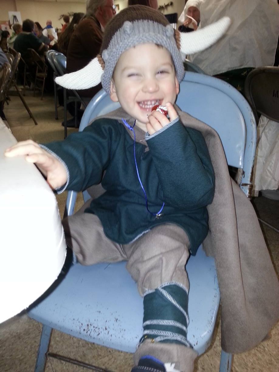 Cristina, This jovial little boy is wearing Linen Bocksten tunic and leg wraps with a wool cloak and pants. Th...