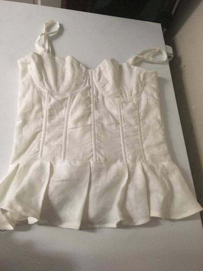 Yasmin, Pleated Shell cup bustier top made with IL019 BLEACHED-FS Signature Finish.
Designed and made by: Y...