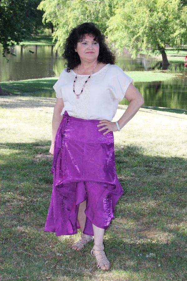 Synthia, I sewed up the Designer Stitch Kat Blouse out of a linen blend fabric and sewed a lace applique. A...