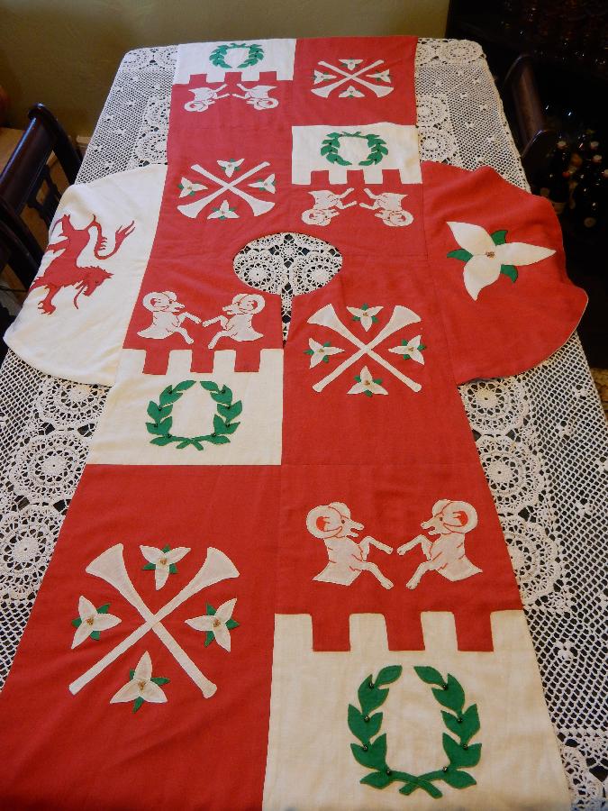 Elise, This is a heraldic tabard completed in red, white, and green mid-weight linen.  The appliques have c...
