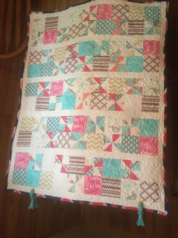 Krystal, Crib size quilt made for a very special Lady for her baby girl. Free motion quilted it.