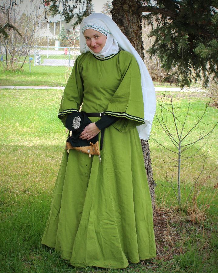 Red, Linen from Fabrics-store. 
both the under kirtle and the gown, cap, whimple and veil
