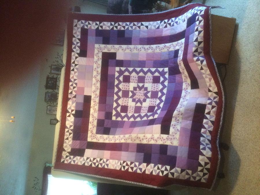 Krystal, It is a queen size quilt I made in purples and burgundys and I donated it to a group to be raffled...