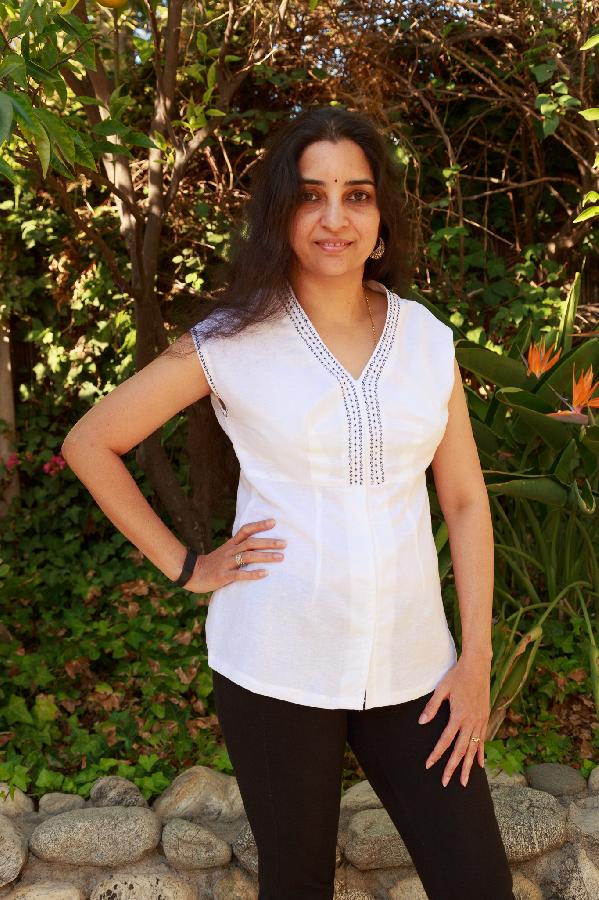 Janaki, I made this with light weight linen fabric and machine-embroidered around the neck and arm hole. Thi...