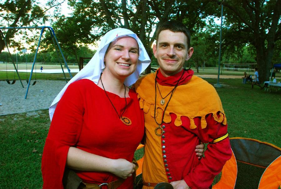 Jessica, 14th century womens cotehardie (heavyweight crimson) and linen veil. 14th century mans particolore...