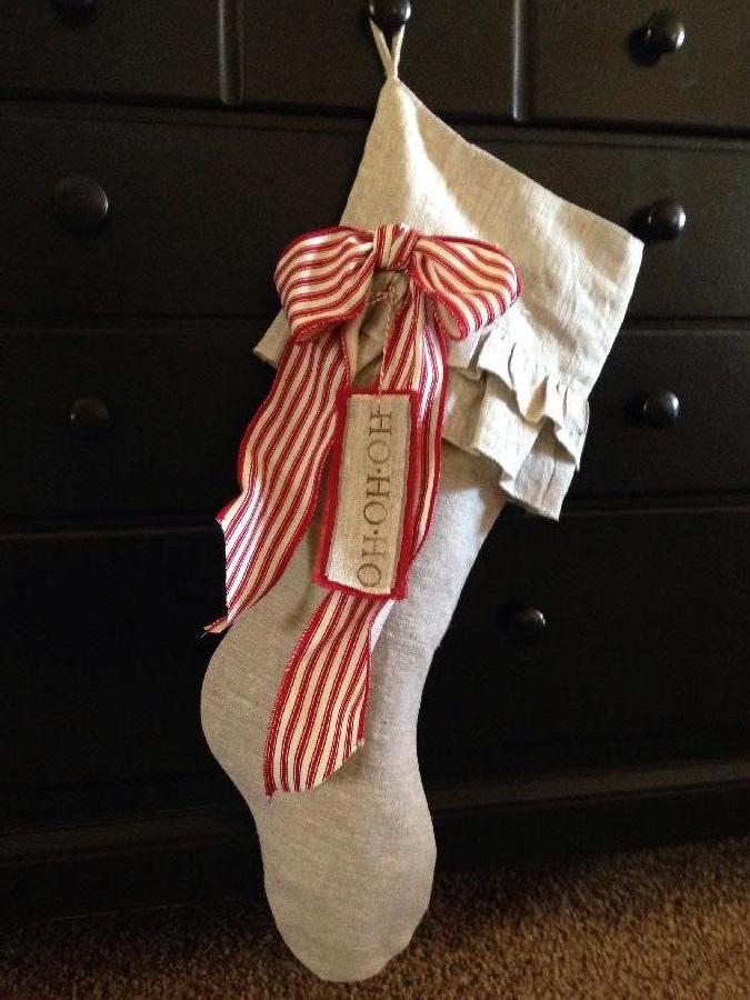 Bridget, Solid raw natural linen Christmas stocking accented with a red stripe bow. Pattern Designed specific...