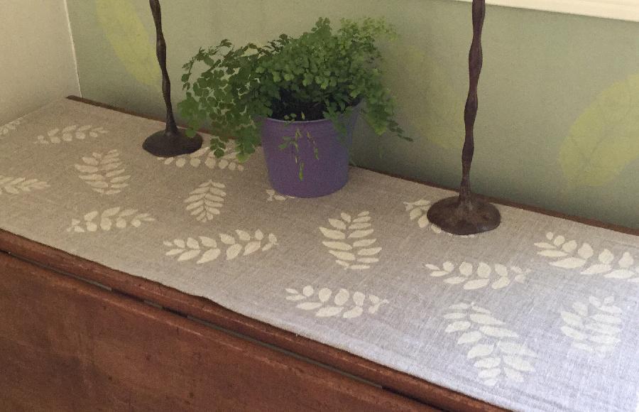 Elizabeth, Table runner in Natural Rustic linen with off white handprinted leaf pattern.