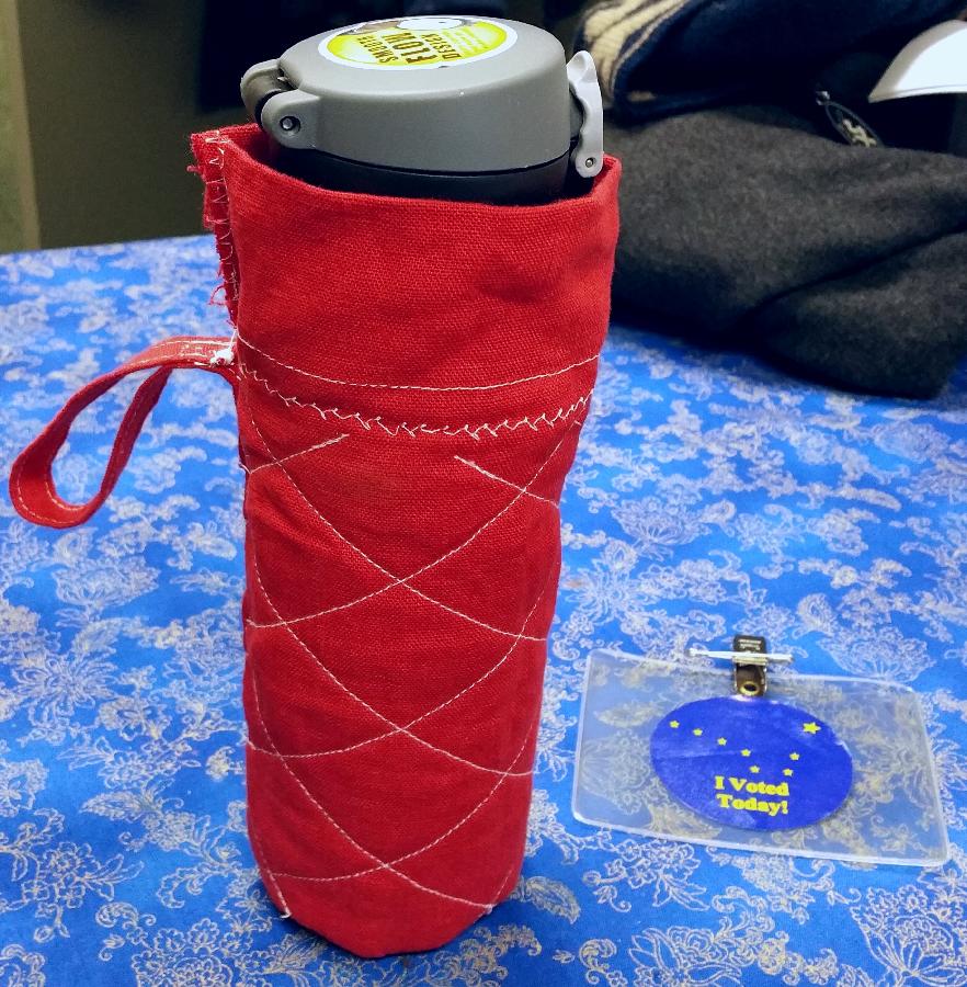 C, I made this thermos cover last night with a belt loop.  Its made of crimson linen with a liner of f...