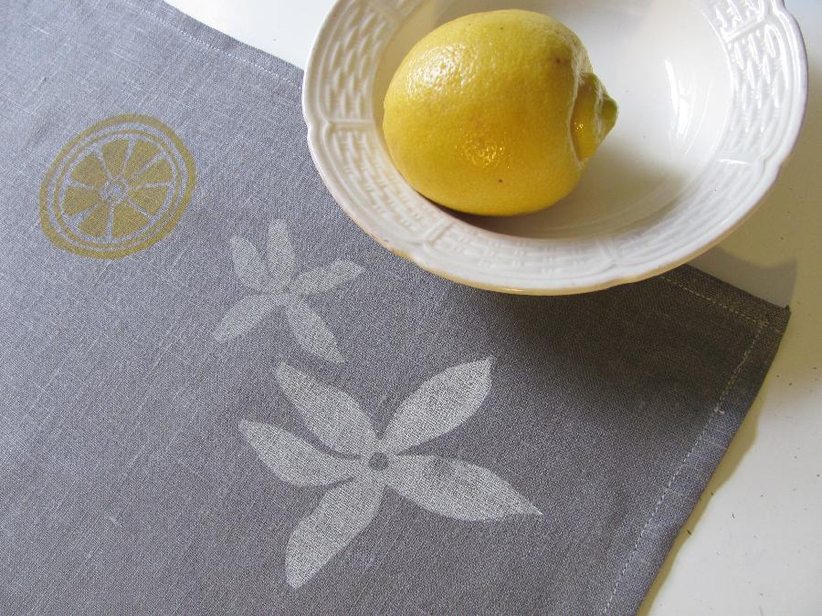 Amy armour, Blockprinted linen teatowel featuring a design of lemon blossoms and sliced lemons. Linen is med. we...