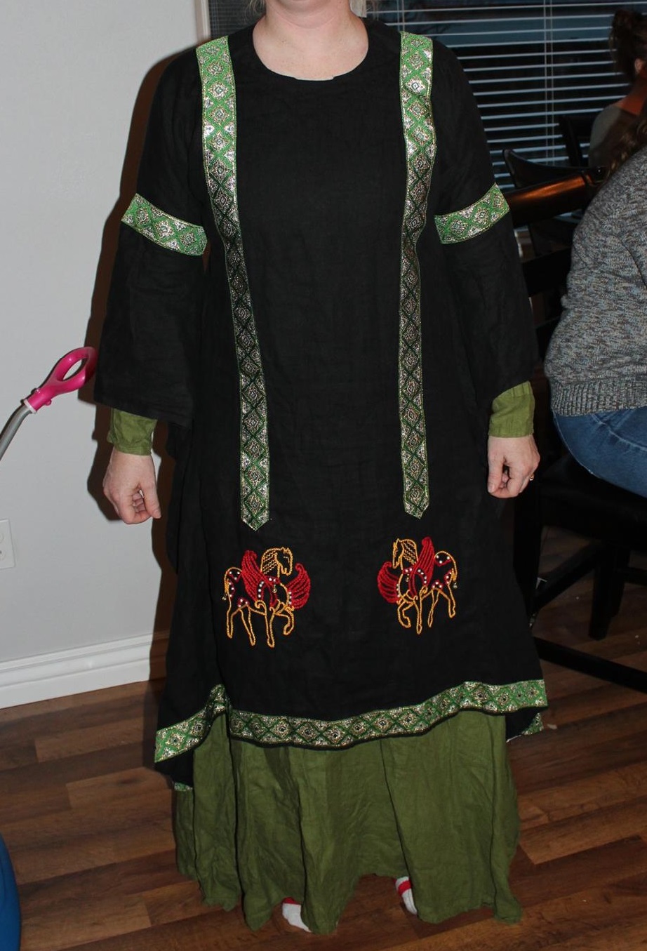 Elise, This is a byzantine dress with a mullet hemline (short in the front, long in the back). The embroi...