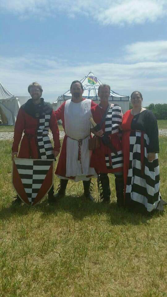 Amberly, Matching 14th Century English heraldic outfits in the arms of Sir Duncan Fearmac McCloud. Red and bl...