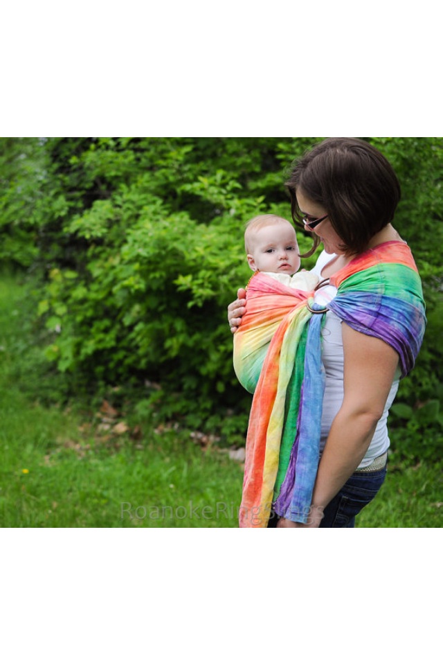 Savanah, This is a ring sling. I took white linen and tie dyed it. It helps parents keep their child close wh...
