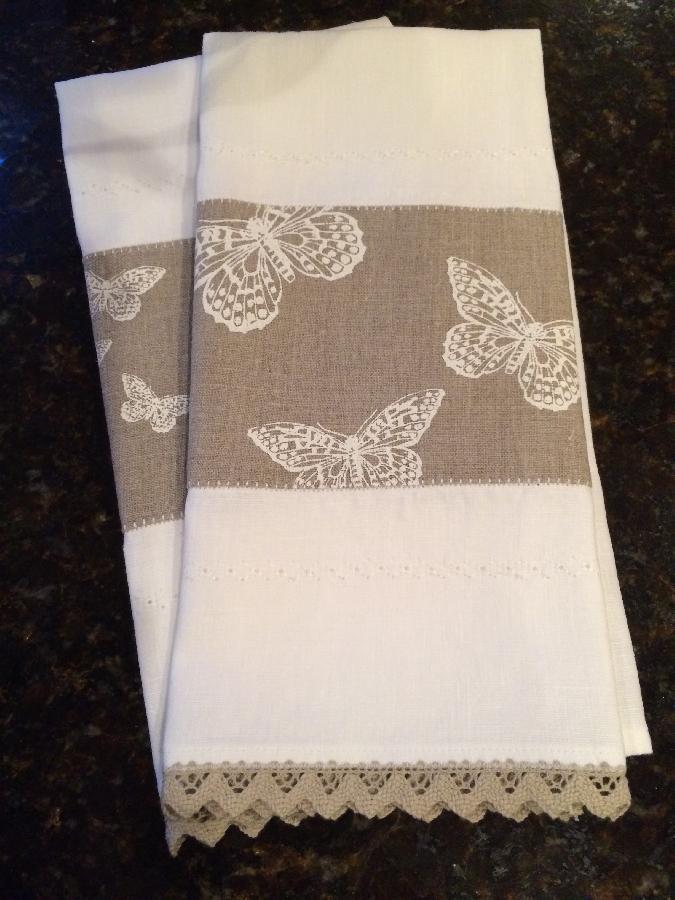 Ronda, Linen tea towels with hand-stamped butterflies and decorative stitching.