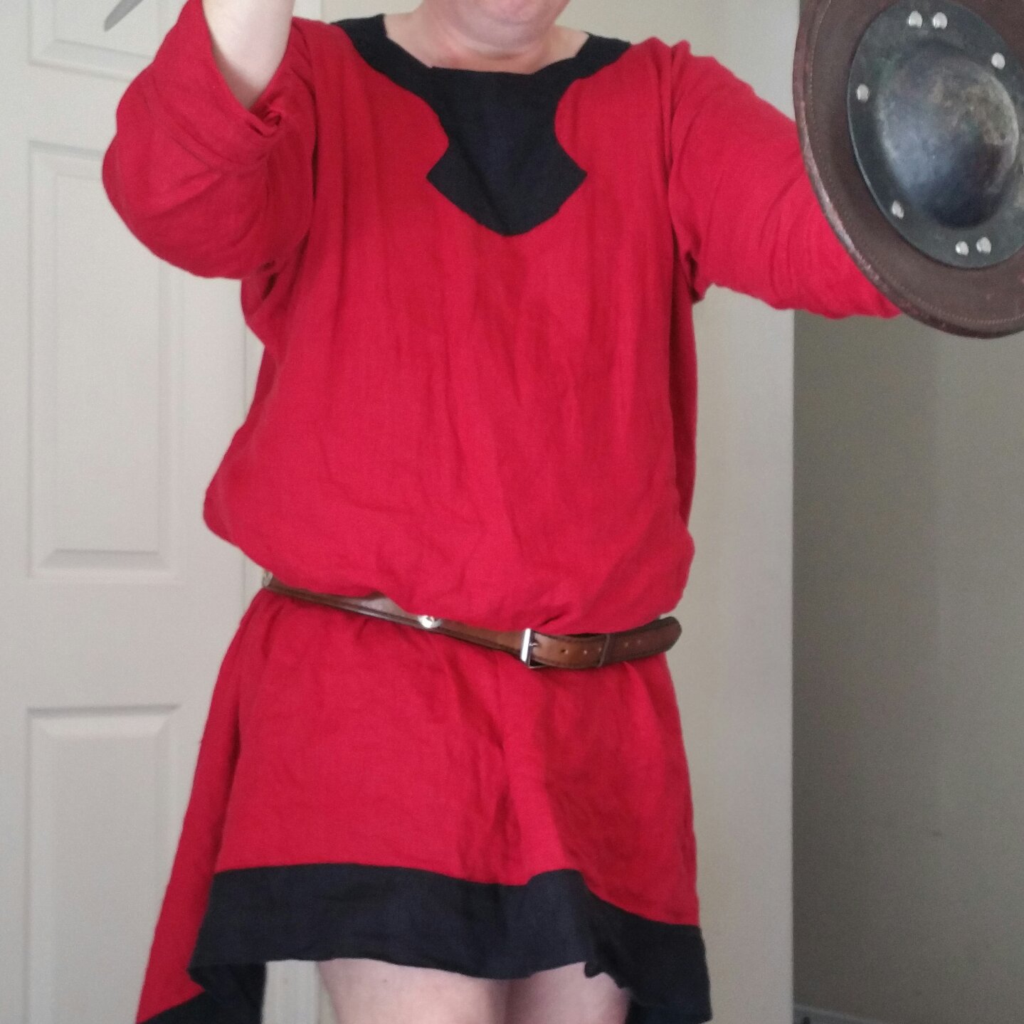 C, Medieval tunic in crimson and black.  This was my first garment.   One of the sleeves is folded back...