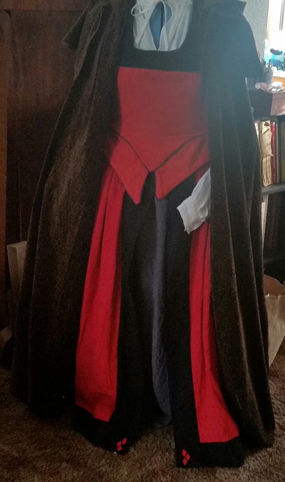 Krysti, Harley Quinn inspired Renn Faire dress made from Firecracker red trimmed with Black, with a kirtle m...