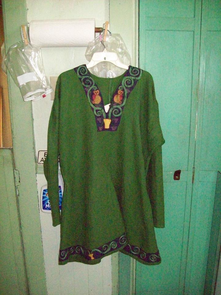 Brenda, This is my idea of a 12th century Northern German tunic.  It is entirely handsewn in green and purpl...